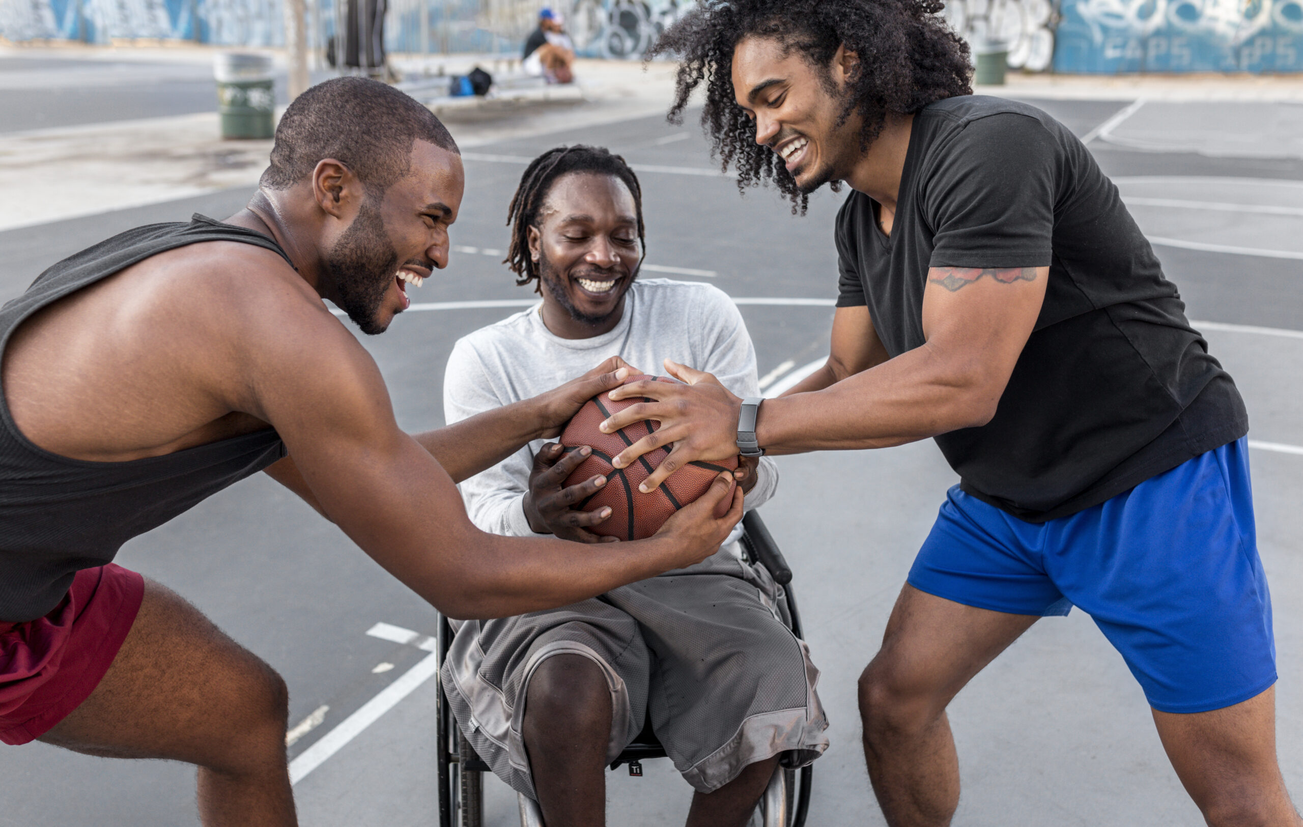 disabled-man-wheelchair-playing-basketball-with-people